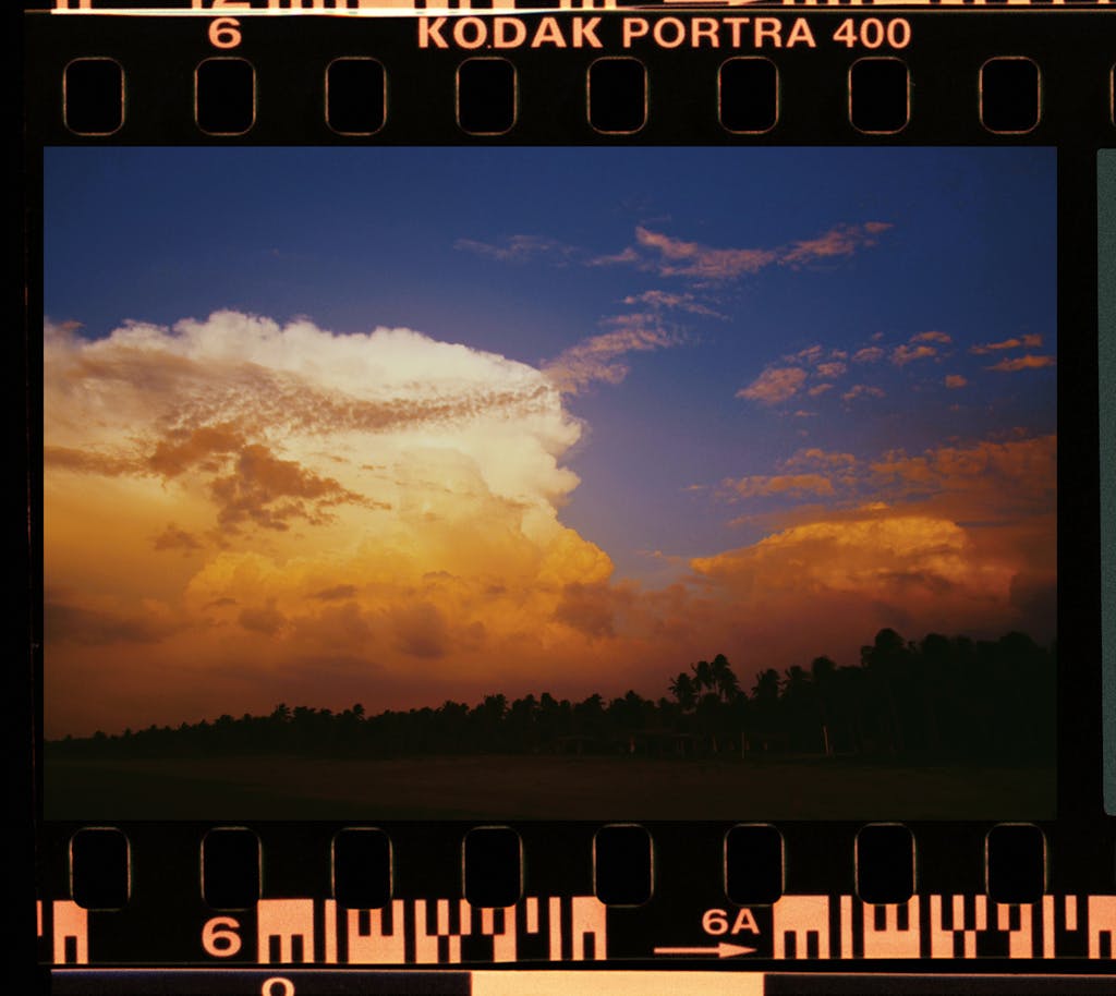 Capture of a vibrant sunset with dramatic clouds on Kodak Portra 400 film.